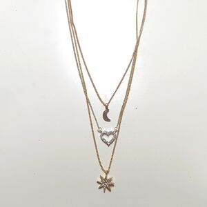 Gold and silver moon and sun necklace stack